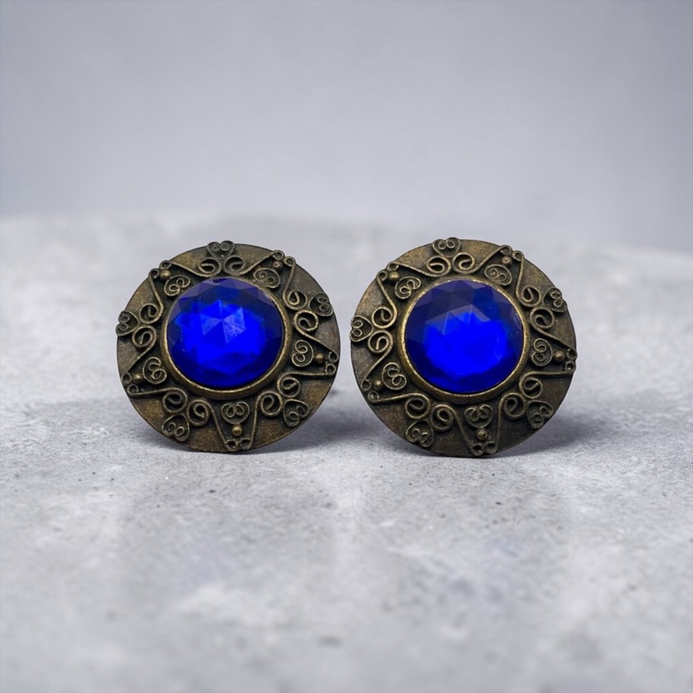 Vintage Don Lin Round Ornate Aged Gold Tone With Faux Blue Stone Clip Earrings
